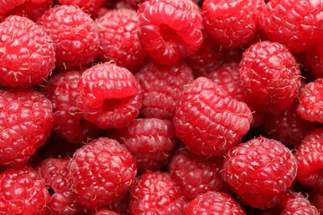 Fresh ripe raspberries as background, closeup view