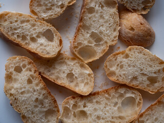 Many Slices of Bread Top View on white background. Still Life Rustic Food