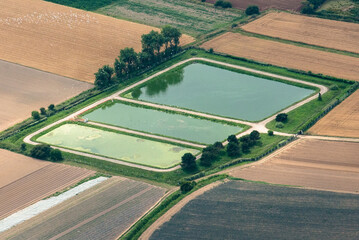 Vue a&eacute;rienne d'une r&eacute;serve d'eau &agrave; Saint Vaast-la-Hougue en France
