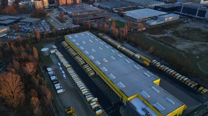 Deutsche Post logistics center with delivery vans. Best aerial view drone - Powered by Adobe