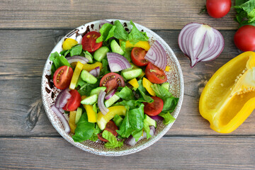 Vibrant Mixed Green Salad with Fresh Vegetables and Balsamic Glaze top view