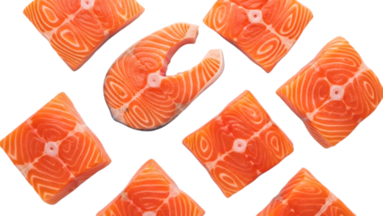 Fresh raw salmon fillets and steak pieces scattered overhead view isolated on transparent background