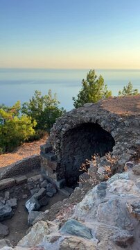 Ruins of the ancient Roman port city of Siedra in Alanya, Antalya, Turkey. The street and ruins of the ancient abandoned ancient city of Siedra on the Mediterranean coast. 4К