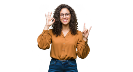 Young woman with curly hair and glasses making ok and rock on hand gestures isolated on transparent background