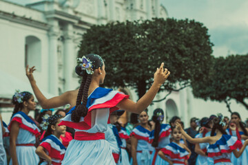 Fototapeta premium dance, dancer, traditional, celebration, festival, culture, performance, heritage, attire, colorful, music, event, community, joyful, outdoor, braided hair, flowers, crowd, expression, rhythm, movemen