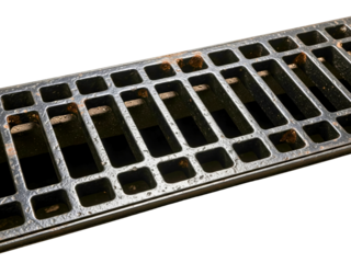 Rusty black metal trench drain grate with rectangular grid pattern on a transparent background