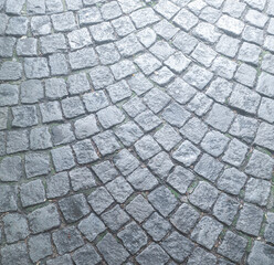 a cobblestone pavement on the road. background.