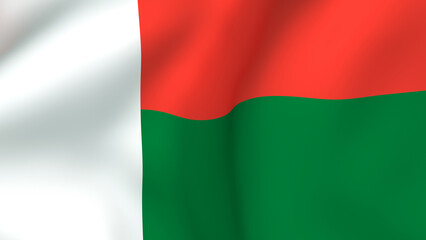 Waving fabric flag of Madagascar with a white vertical band and horizontal red and green stripes