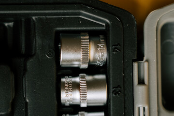 Tools are organized in a toolbox with several sockets ready for use during a project