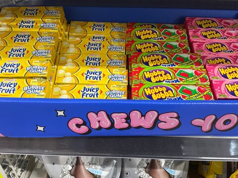 Grocery store Hubba Bubba bubble gum display at checkout various flavors