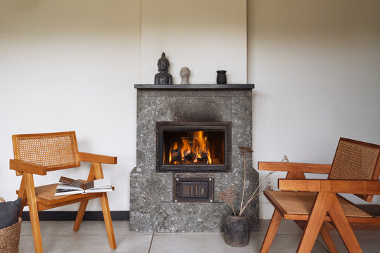 Cozy living room with a modern fireplace and rustic decor for winter warmth