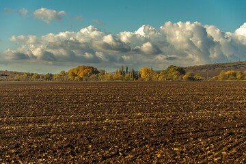 a field in the foothills of the Western Caucasus, plowed before the onset of winter on a sunny autumn day in early November