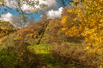 The hill of an ancient fortress-fortress of the Bronze Age in the foothills of the Western Caucasus on a sunny autumn day in early November