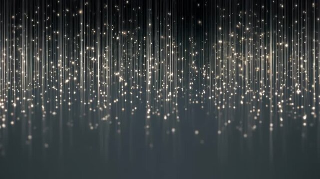 Glistening vertical lines of silver glitter fall gracefully, creating a stunning and enchanting display against a dark background in a festive setting