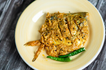 Spicy pabda fish curry gravy.