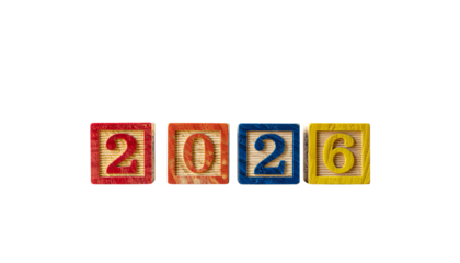Colorful wooden blocks displaying the year 2026 in red orange blue and yellow numbers against a stark pure white background cutout