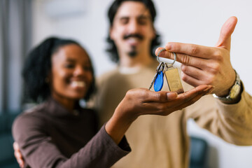 Happy couple holding new home keys