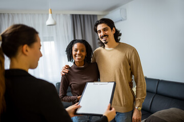 Real estate agent showing apartment to couple