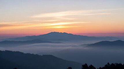 Obraz premium Majestic mountain sunrise over misty valleys