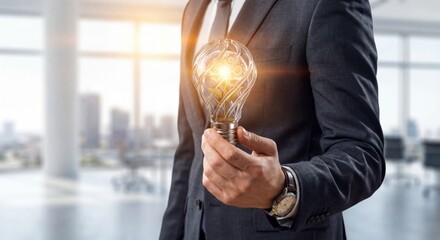 businessman holding light bulb office new idea concept