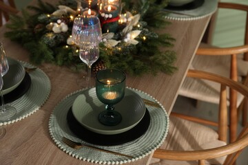 Festive table setting with Christmas decor indoors, closeup