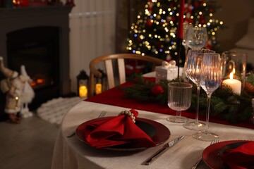 Festive table setting with Christmas decor indoors, closeup