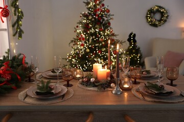 Festive table setting with Christmas decor indoors