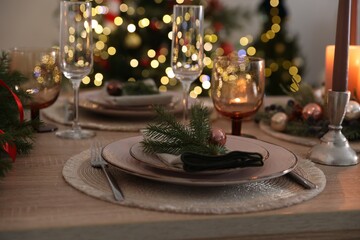 Festive table setting with Christmas decor indoors, closeup