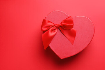Happy Valentine's Day. Heart shaped gift box on red background, top view. Space for text