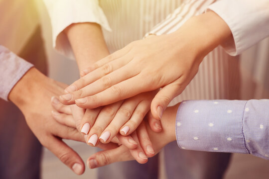 Group of volunteers stacking hands, closeup. Charity, support, teamwork - Powered by Adobe