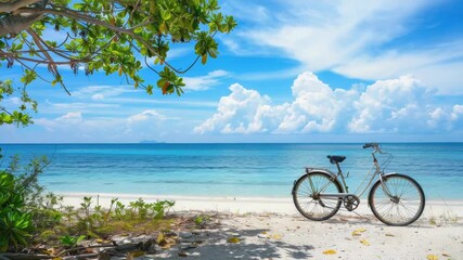 Video A bicycle parked on a sandy beach with the ocean in the background, perfect for a leisurely ride or as a scenic prop