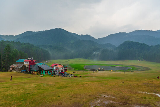Panoramic view of famous tourist destination Khajjiar, It is green meadow with lake nestled down in the foothills of Dhauladhar ranges of the Western Himalayas.