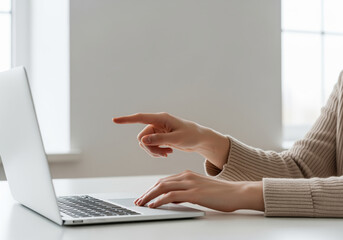 Participant interacting with laptop interface during remote usability testing session, pointing at screen while giving feedback on new software prototype for UX research and product design decisions