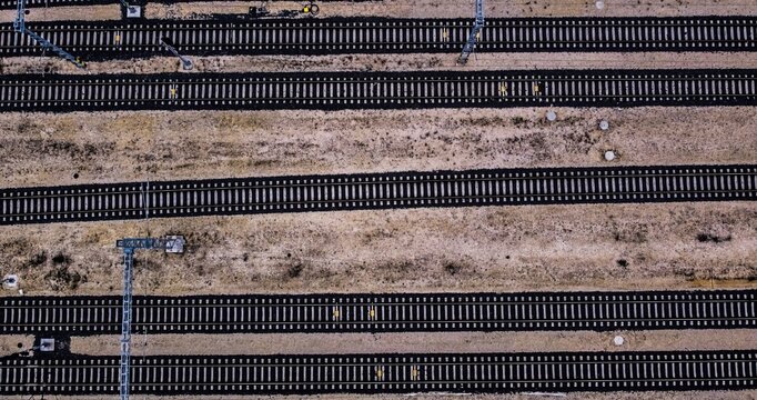 Parallel railway tracks from aerial perspective
