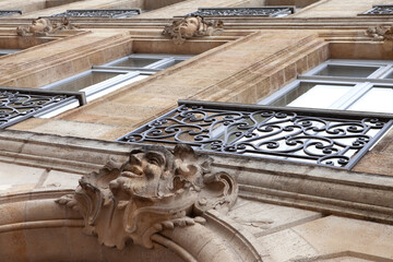 Facade statuettes called mascarons on classical architecture