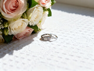 wedding rings on a bouquet of flowers