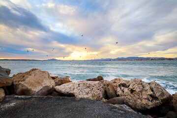 Beautiful view of the sea from a breakwater at sunset