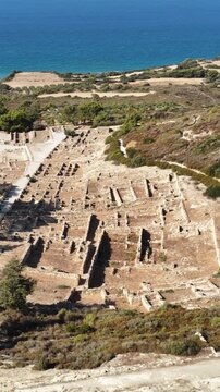 Aerial exploration of ancient Kamiros ruins near the Aegean Sea in Rodos Greece on a bright sunny day