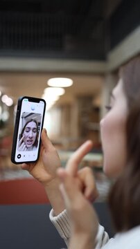 Vertical screen girl shows her acne to ChatGPT during a video call asking for advice on how to treat her skin and looking for reassurance while discussing her concerns openly