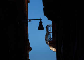 old street lamp in venice with balcony