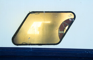 Sun reflected in the windows of a fishing boat
