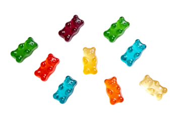 Colorful gummy bears arranged in a circular pattern on a transparent background. Concept of sweetness, fun and playful variety.