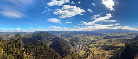 Panoramic view of Pieniny Mountain Valley View Over Village and Dunajec River Under Bright Blue Sky