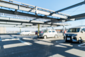 晴天の屋上駐車場をぼかした背景素材