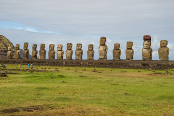 Moai statues at Ahu Tongariki, Easter Island under a cloudy sky