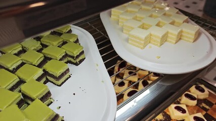 Colorful, layered desserts display an array of vibrant flavors and textures, inviting indulgence and delight for every sweet tooth.