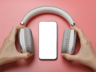 Hands holding wireless headphones around a smartphone on a pink background. Modern technology, music and mobile concept
