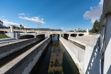 View of the Los Angeles River passing under the Glendale Blvd and Hyperian Blvd bridges in the Atwater Village area of Los Angeles, California.