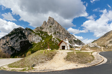 Small alpine chapel at the foot of Sass de Stria mountain, Falzarego Pass, Italian Dolomites.