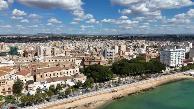 Amazing panoramic drone video clip from the coast of Mazara del Vallo, a beautiful sicilian southern coast city, taken during a roadtrip in the end of summer.